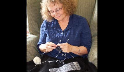 Beth Brown-Reinsel knitting a ‘Midge and Fly’ Sanquhar glove. (Photo: Beth Brown-Reinsel)