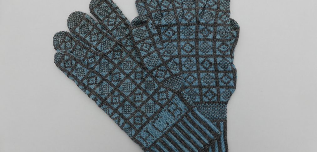 ‘Duke’ patterned gloves, ca. 1971, with “HCB” knitted into the cuff. Collection of the Knitting & Crochet Guild, UK. (Photo: Angharad Thomas, courtesy Board of the KCG)